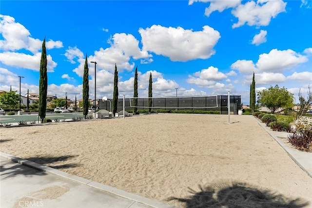 view of home's community with fence and volleyball court