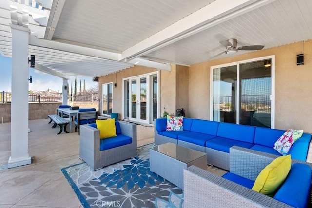 view of patio featuring outdoor dining area, french doors, an outdoor hangout area, a ceiling fan, and fence