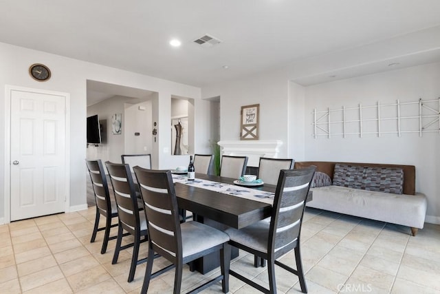 dining space with light tile patterned flooring