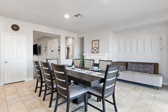 dining space with recessed lighting, baseboards, visible vents, and light tile patterned flooring