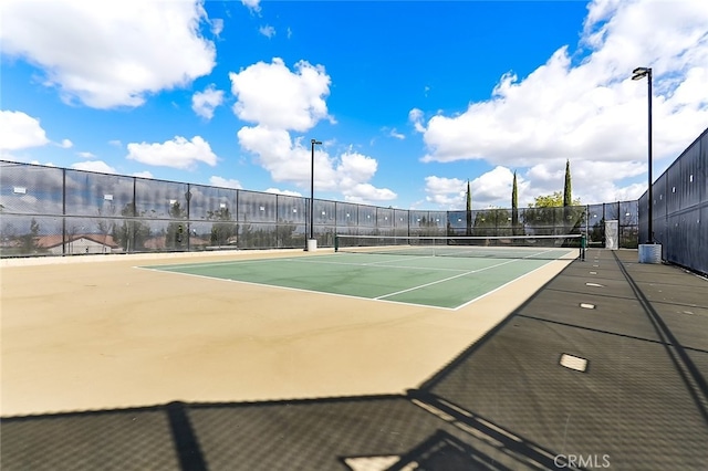 view of sport court with fence