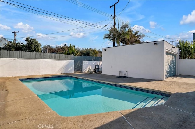 view of swimming pool featuring a patio area