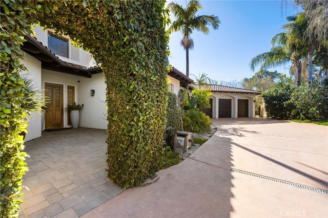 view of side of property featuring a garage