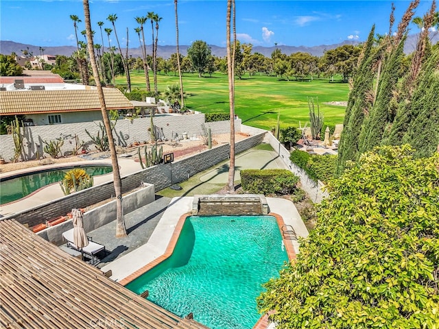 view of pool featuring a mountain view and a patio area