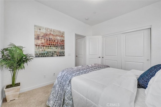 carpeted bedroom with a closet