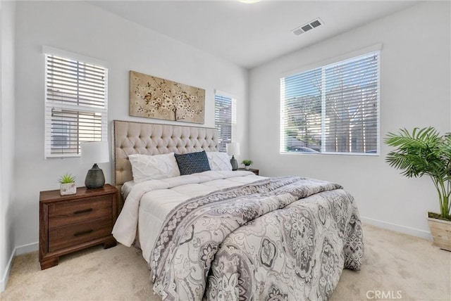 bedroom with light carpet