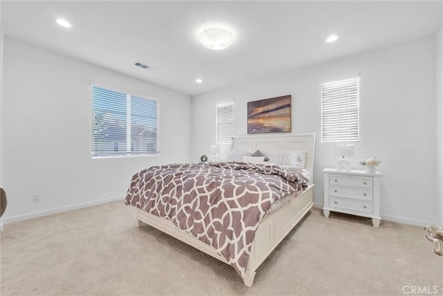 bedroom featuring light carpet