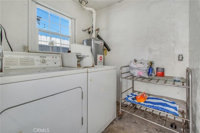 washroom featuring water heater and washer and dryer