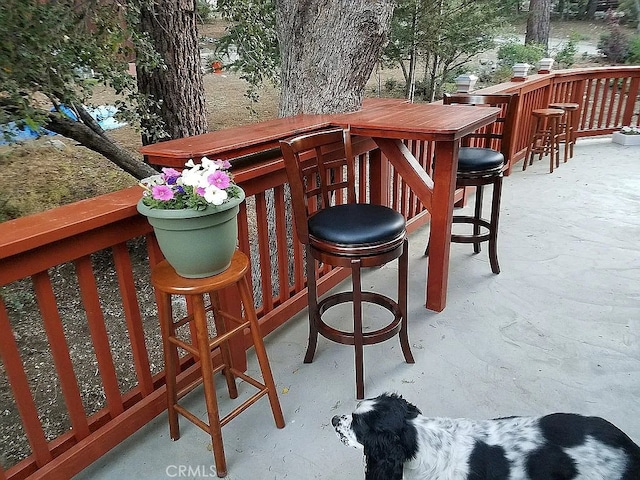 wooden terrace with an outdoor bar