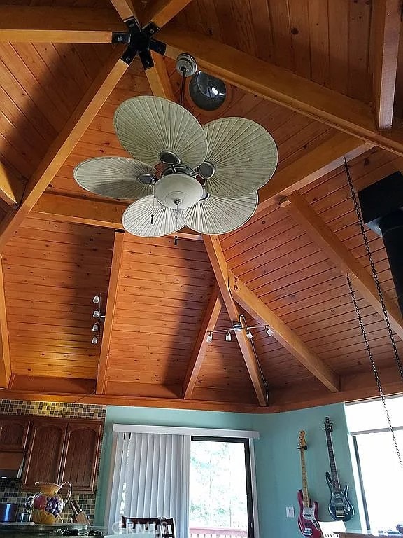 details with ceiling fan, wood ceiling, and beamed ceiling