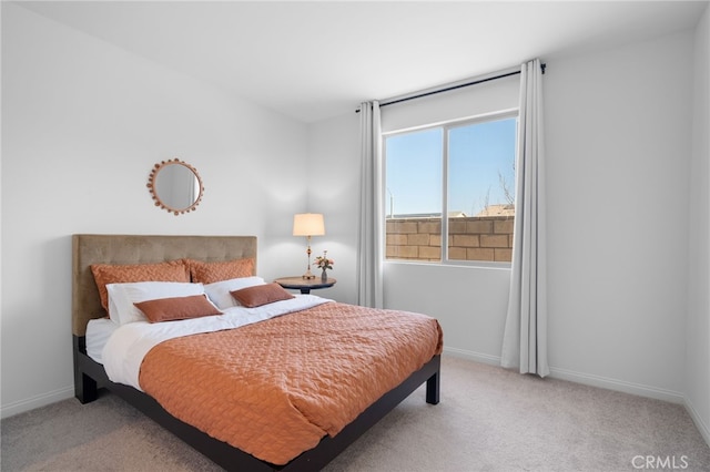 bedroom featuring light carpet