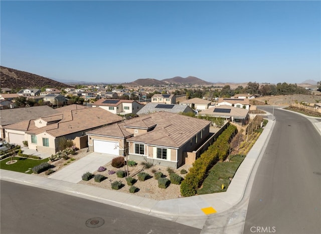 drone / aerial view featuring a mountain view