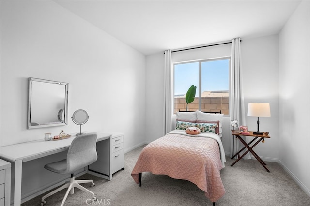 bedroom featuring light colored carpet