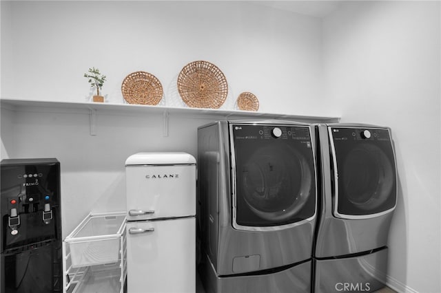 laundry area featuring independent washer and dryer