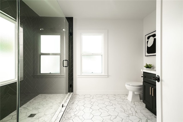 bathroom with a shower with door, toilet, and vanity