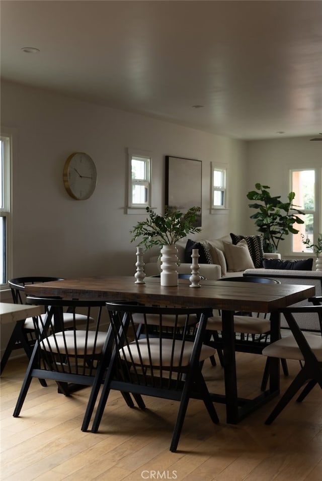 dining space with light wood-type flooring