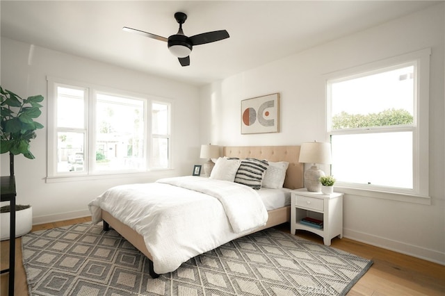 bedroom featuring ceiling fan and hardwood / wood-style floors