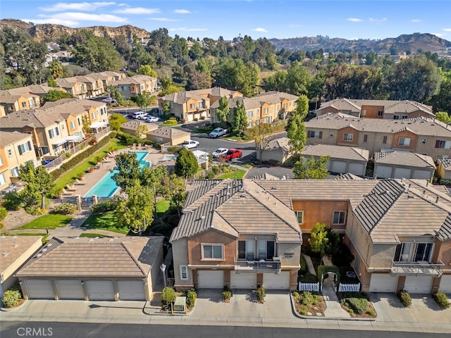 birds eye view of property with a mountain view and a residential view