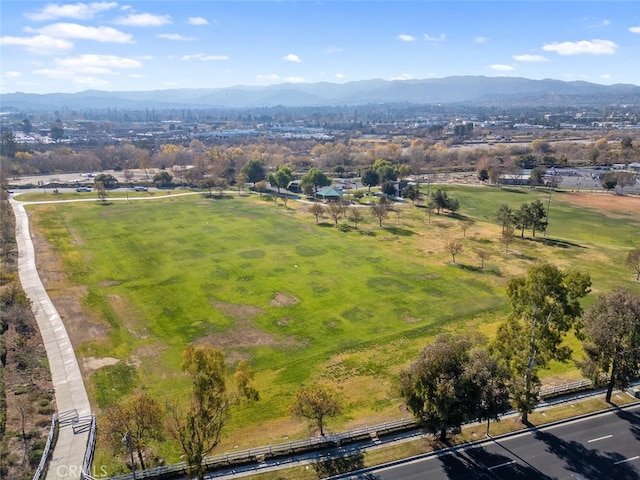 birds eye view of property featuring a mountain view