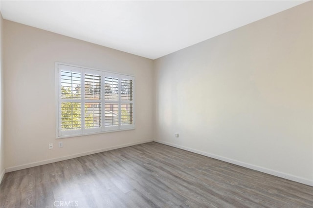 spare room featuring hardwood / wood-style floors