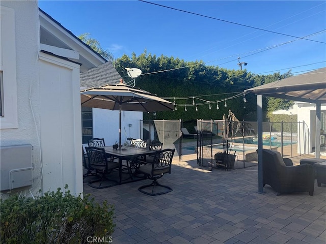 view of patio featuring a fenced in pool