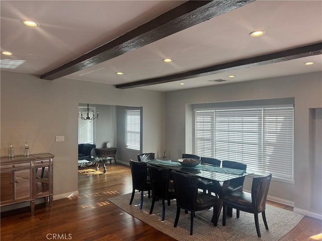 dining area featuring dark hardwood / wood-style flooring, beam ceiling, and a chandelier