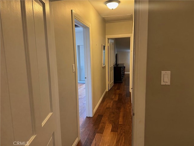 corridor with dark hardwood / wood-style floors