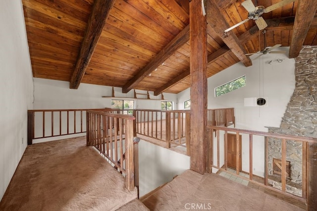 additional living space with a wealth of natural light, beam ceiling, and wood ceiling