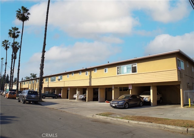 view of building exterior featuring a carport