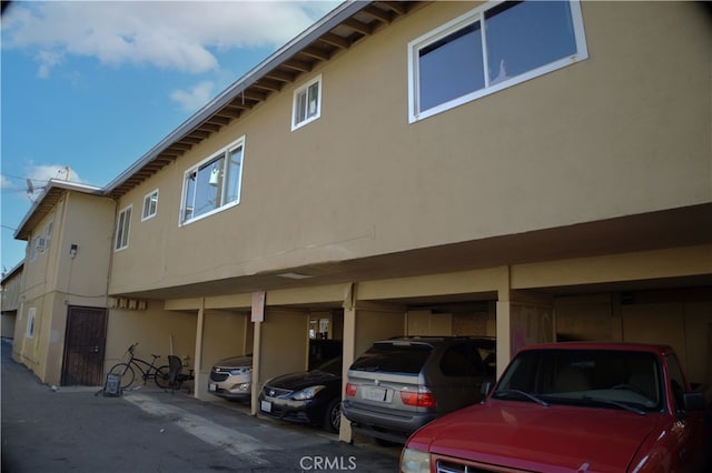 view of side of home featuring a carport