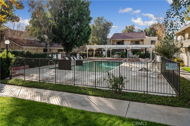 view of swimming pool with a patio area and a pergola