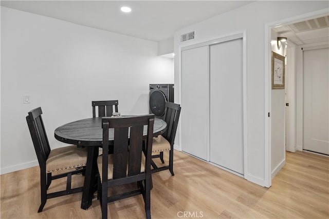 dining space with light wood-type flooring