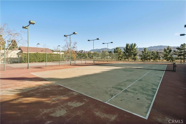 view of sport court with a mountain view