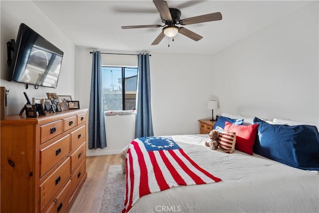 bedroom featuring ceiling fan and light hardwood / wood-style floors