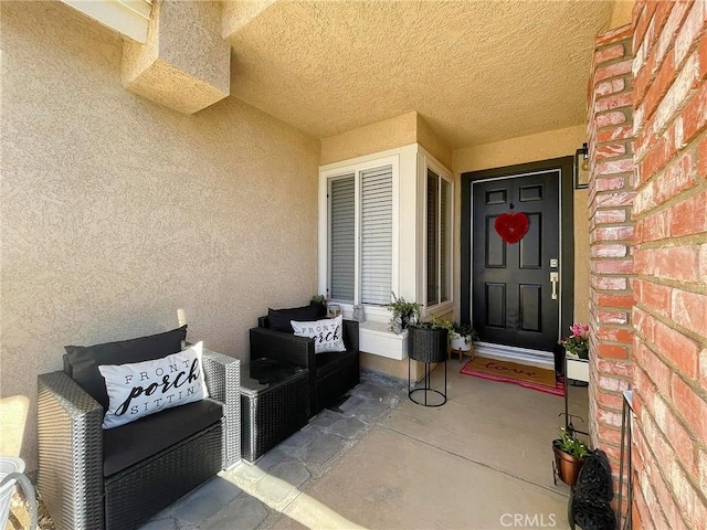 view of exterior entry featuring stucco siding