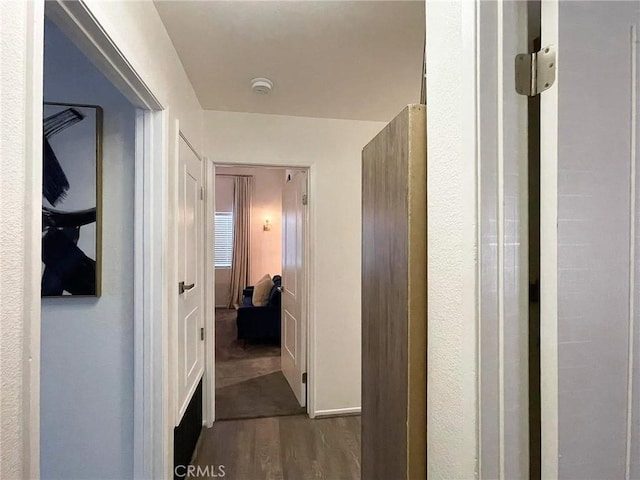 hall featuring wood finished floors