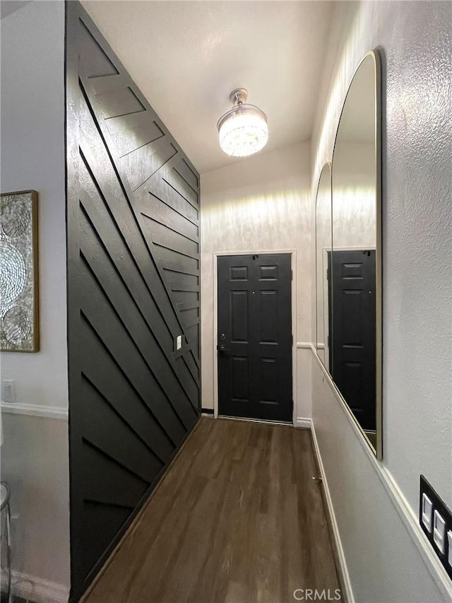 doorway to outside with dark wood-style floors