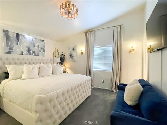 bedroom with lofted ceiling and dark carpet