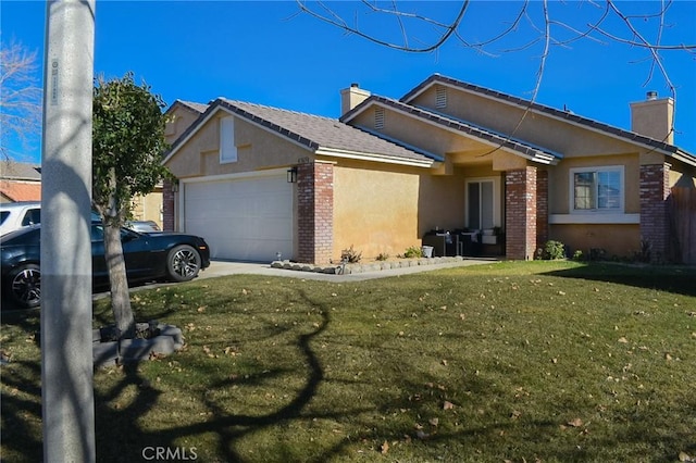 view of front of home with a garage and a front yard