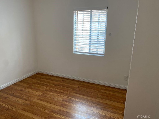 empty room featuring hardwood / wood-style floors