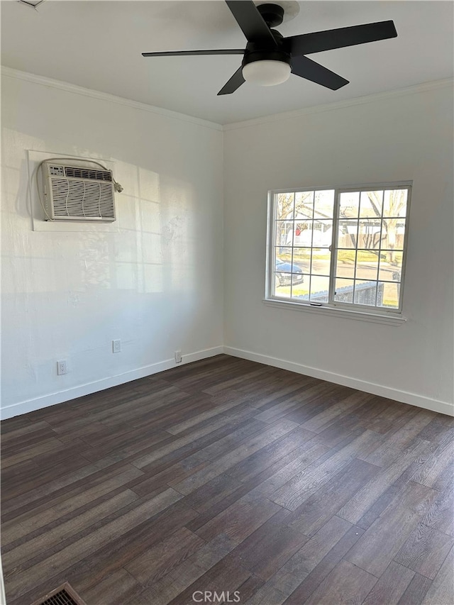 unfurnished room featuring dark hardwood / wood-style floors, ornamental molding, and a wall mounted AC