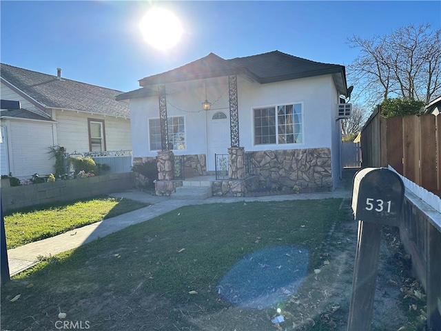 ranch-style home with a front lawn