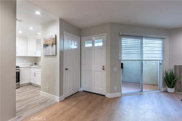 doorway to outside featuring light hardwood / wood-style floors