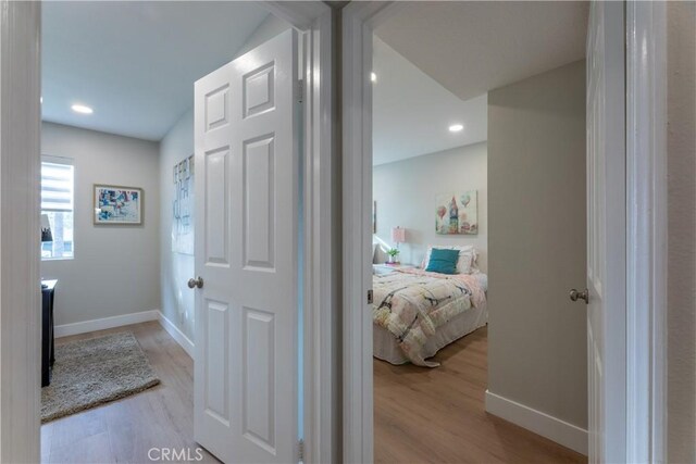 corridor featuring light hardwood / wood-style floors