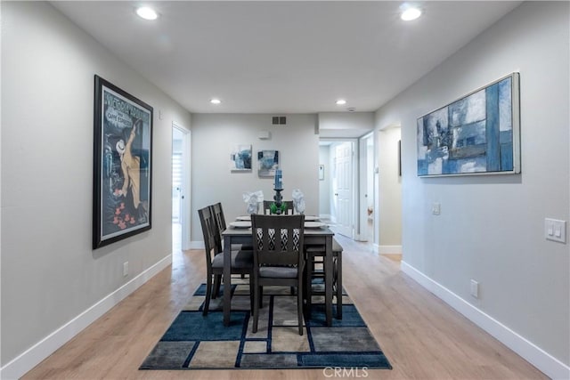 dining area with light wood-type flooring