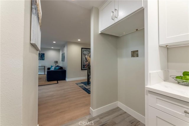 corridor featuring light hardwood / wood-style floors