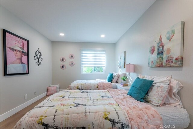 bedroom with wood-type flooring