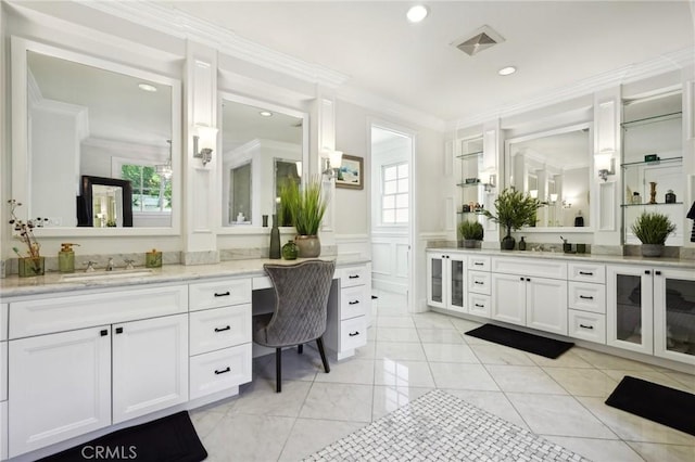 bathroom featuring vanity and ornamental molding