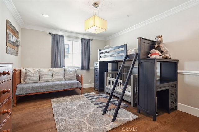 bedroom featuring dark wood-type flooring and crown molding