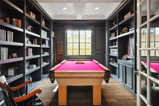 rec room with built in shelves, hardwood / wood-style flooring, and beamed ceiling